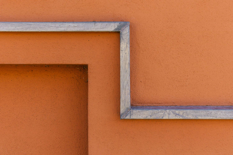 Close-up of orange wall of building