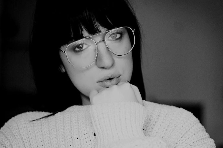 Close-up of young woman with eyeglasses