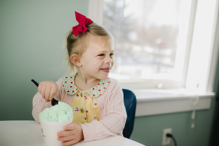 Girl eating ice cream happy