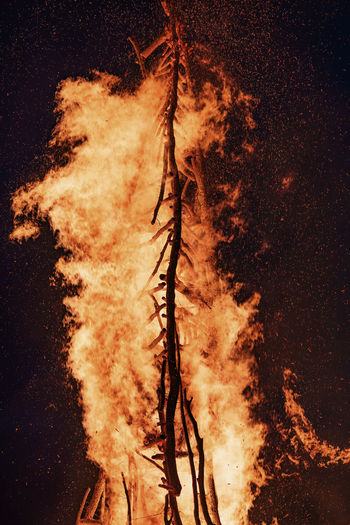Digital composite image of fire on field at night