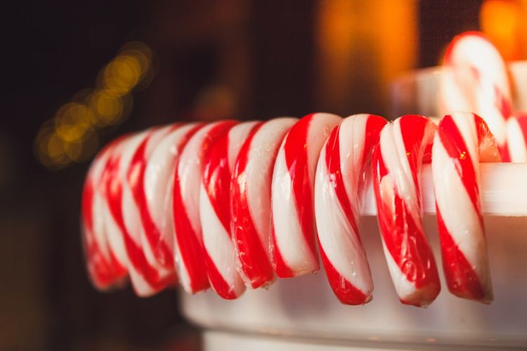 Close-up of candy canes in container
