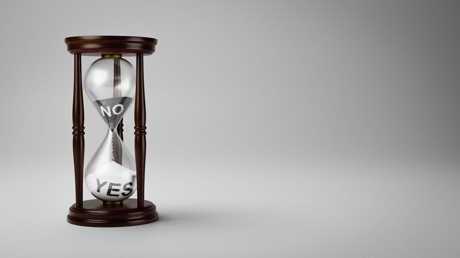 Close-up of clock on glass