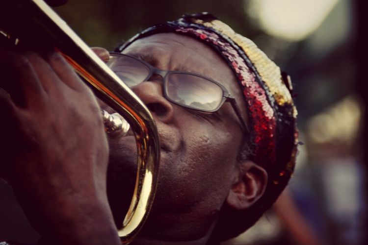 Close-up of man playing trumpet in music festival