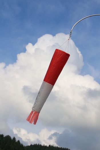 Low angle view of windsock blowing in wind