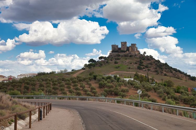 Panoramic view of road against cloudy sky