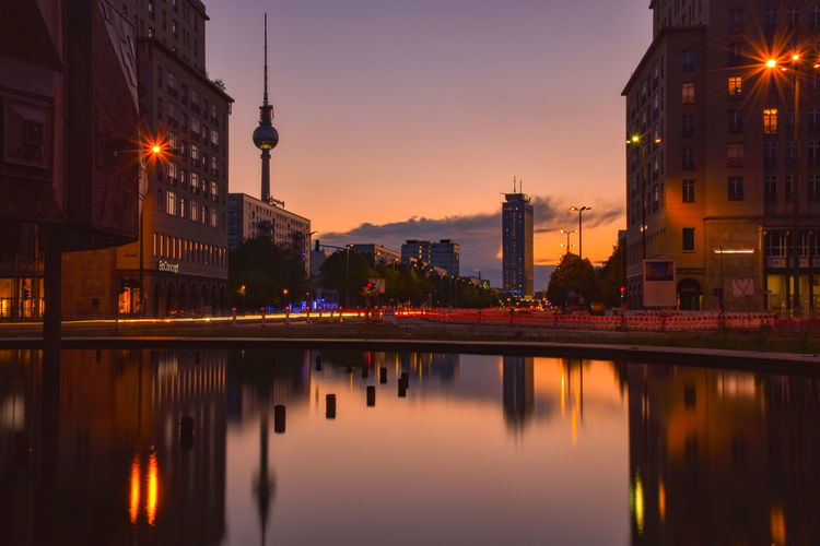 Reflection of buildings in city at night