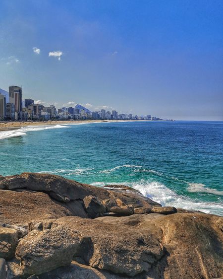 Scenic view of sea against blue sky