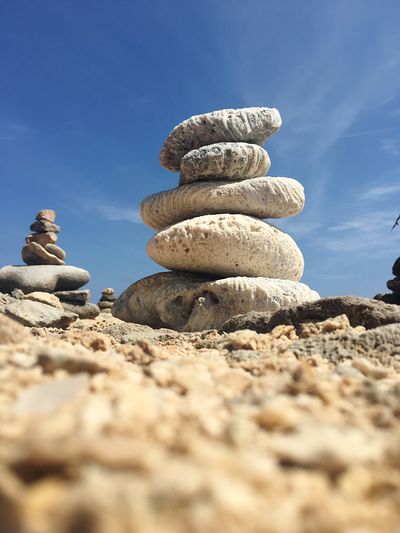 Low angle view of stone stack on rock