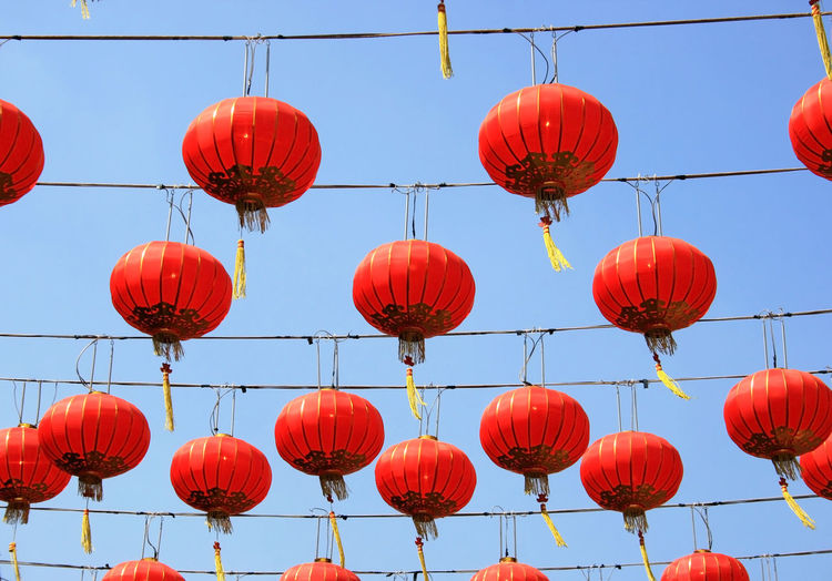 Low angle view of lanterns hanging in row