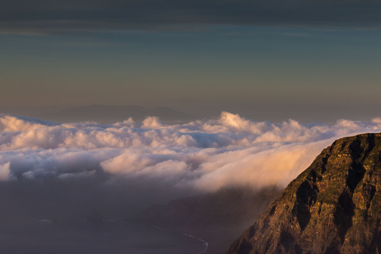 Scenic view of mountains against sky during sunset