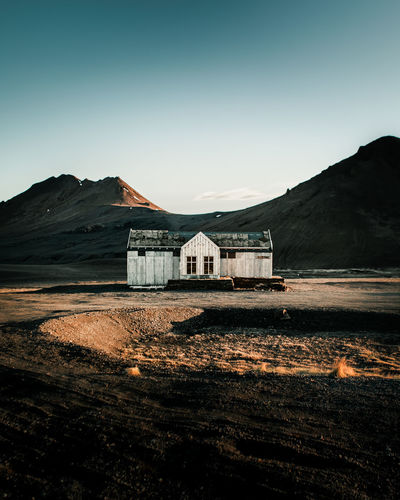 Scenic view of house against clear sky in iceland