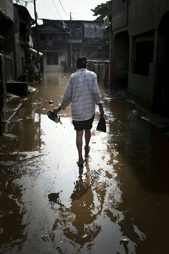 Man on flooded street