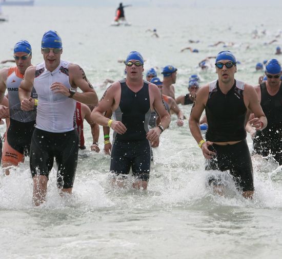 Athletes running in sea