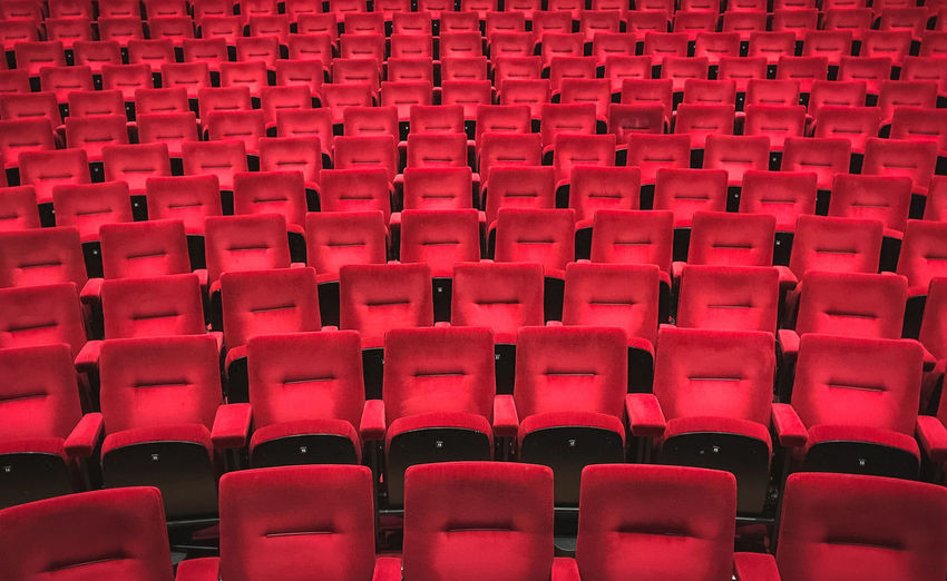 Full frame shot of empty chairs in auditorium
