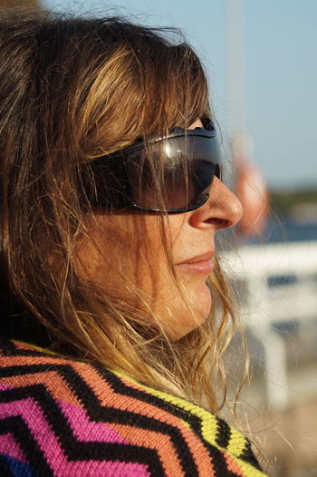 Close-up portrait of woman with sunglasses