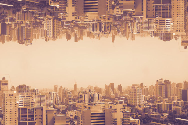 Double exposure photography of aerial cityscape in poor weather morning, haze of pollution