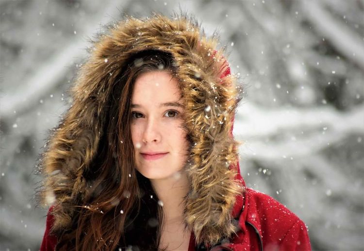 Portrait of young woman in snow