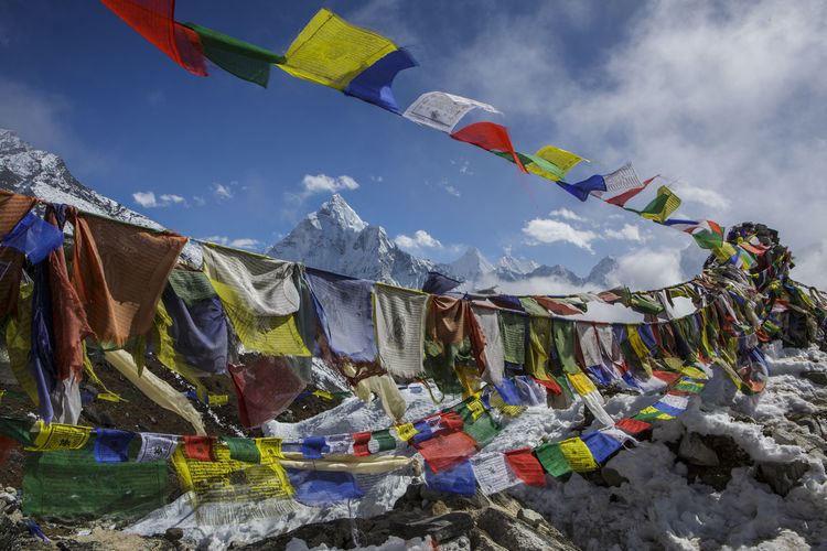 Prayer flags in front of ama dablam in nepal's khumbu valley.