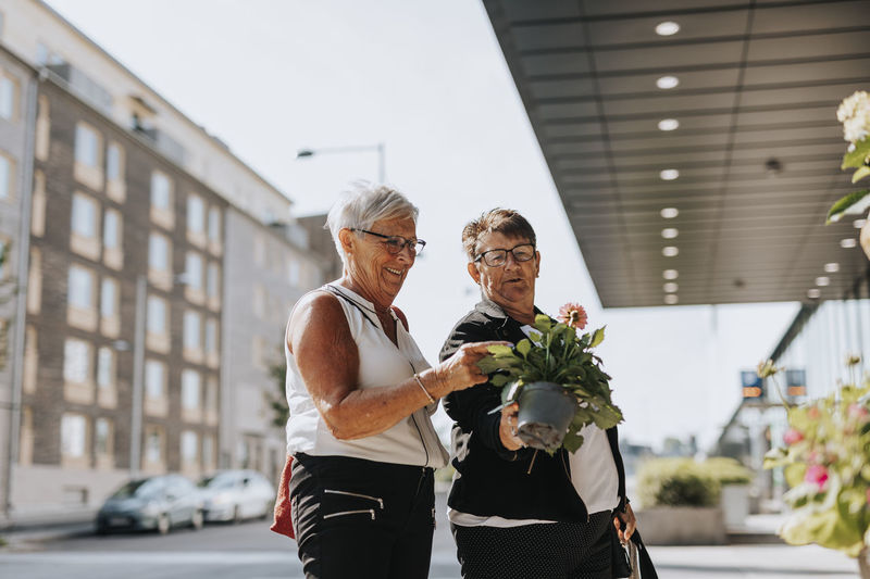 Senior women holding potted flower