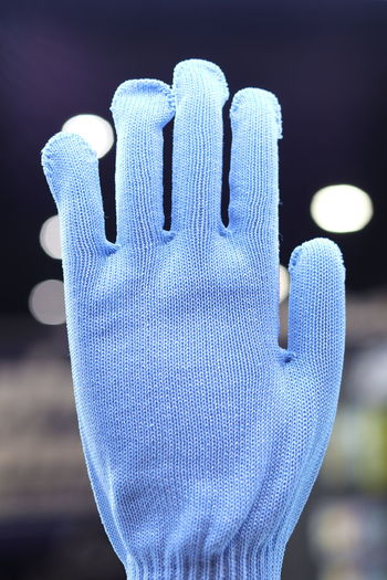 Close-up of human hand on snow