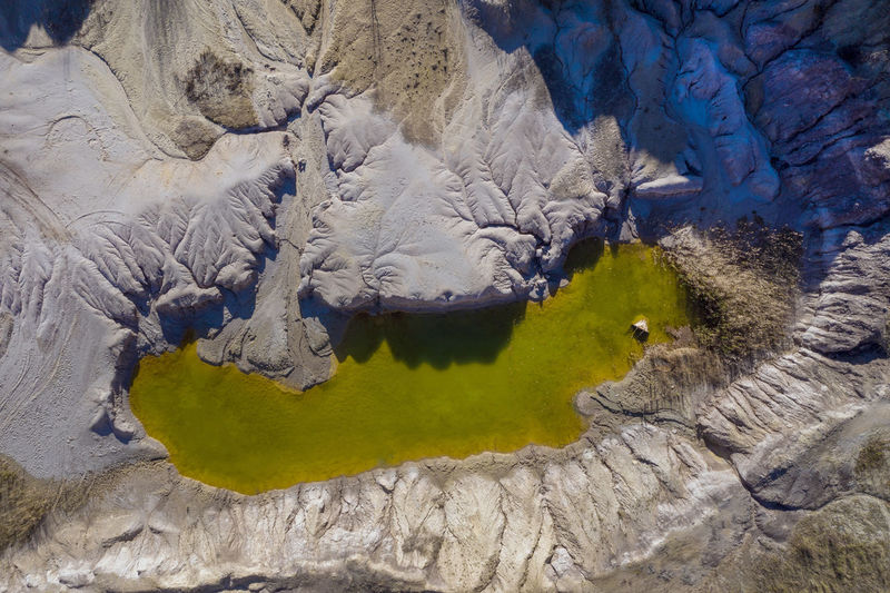 High angle view of rock formation in lake