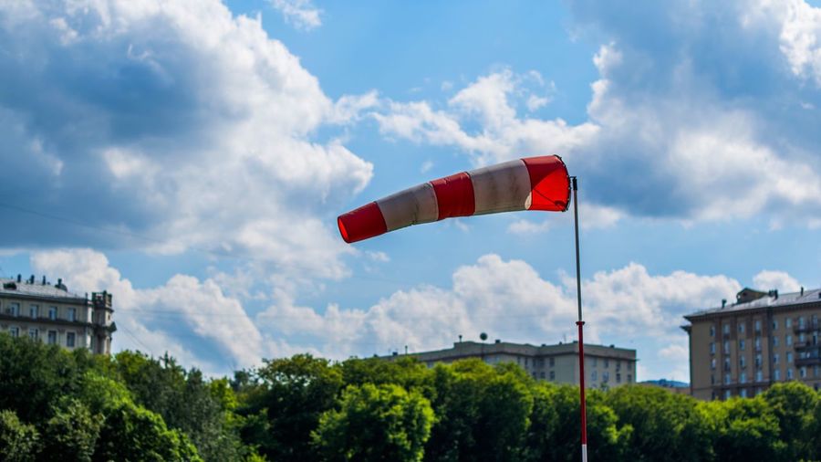 Low angle view of windsock against sky