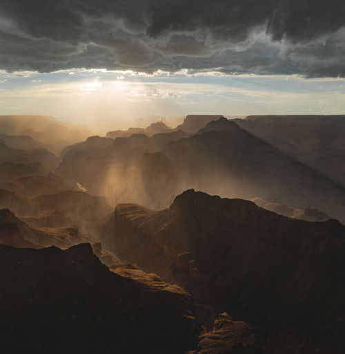 Scenic view of mountains against sky during sunset