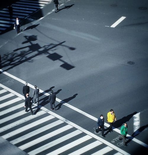 High angle view of pedestrians crossing road