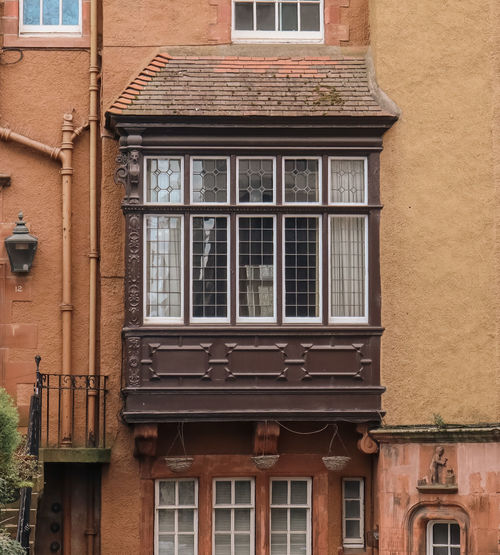 Low angle view of old building near edinburgh castle, ramsay garden, edinburgh, scotland, uk