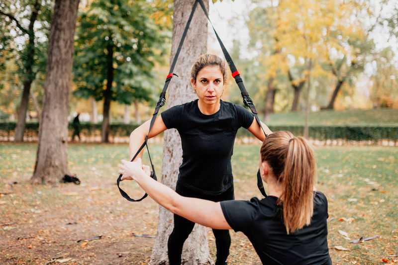 Mid adult women exercising at park