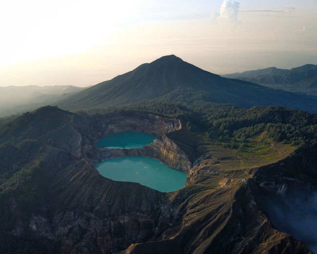 Scenic view of mountains against sky during sunset on kelimutu lake