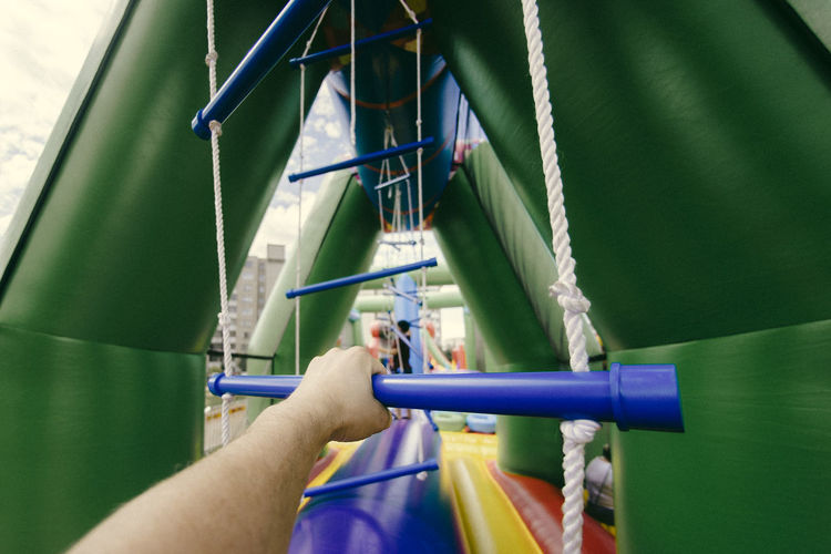 Cropped hand in outdoor play equipment