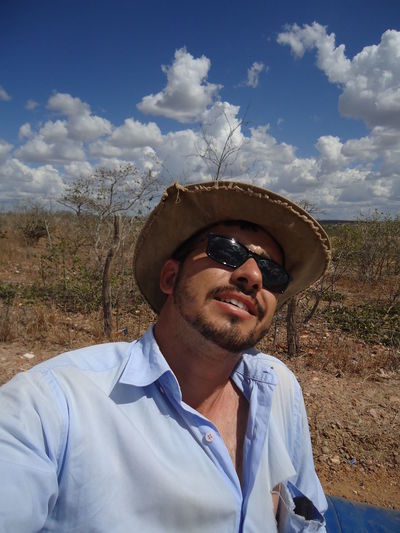 Man wearing sunglasses and hat against sky