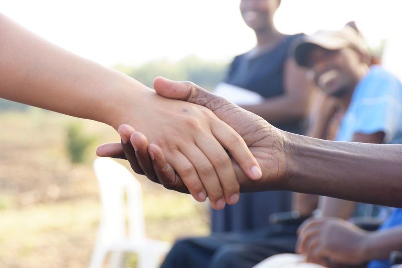 Close-up of people holding hands