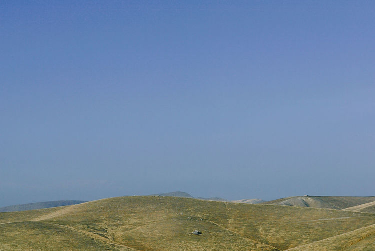 Scenic view of mountains against clear sky