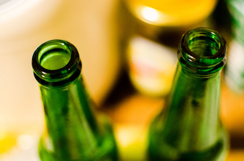 Close-up of beer bottles on table