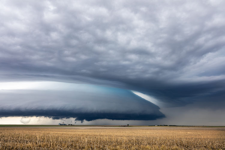 Ominous supercell storm clouds over a field near colby, kansas