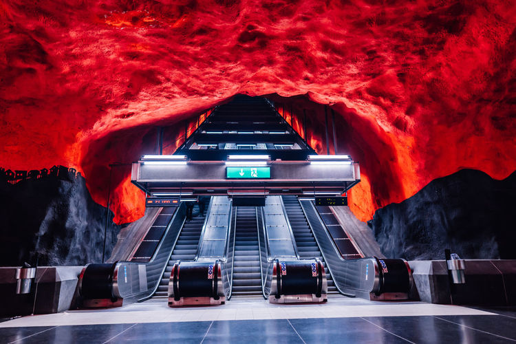 Low angle view of illuminated escalators