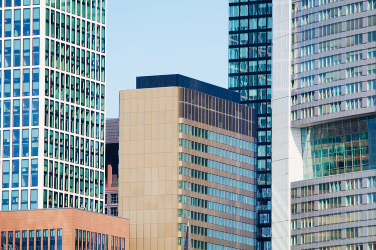 Low angle view of modern buildings against clear sky