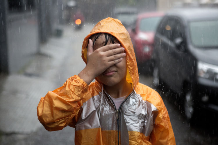 Portrait of a boy in rain
