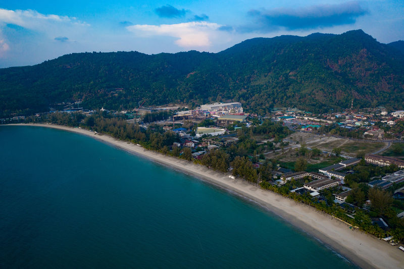 High angle view of sea and buildings against sky