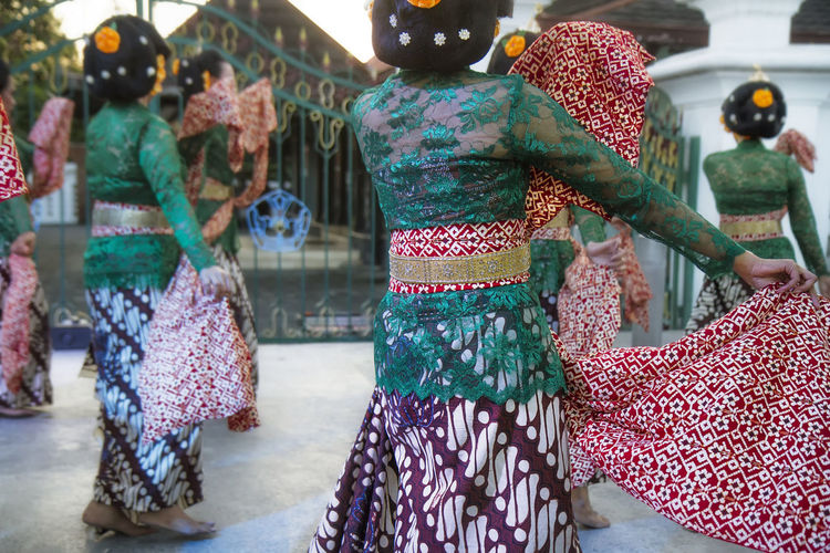 Traditional javanese dancer wearing kebaya and batik while performing