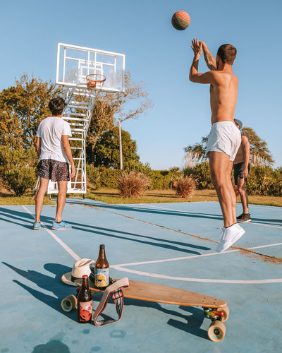 Young men playing basketball 
