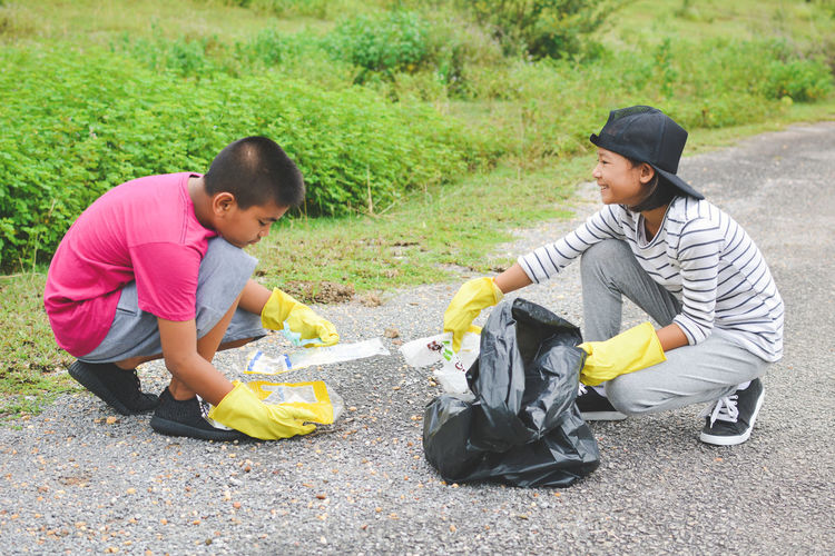 Volunteers collecting garbage on road