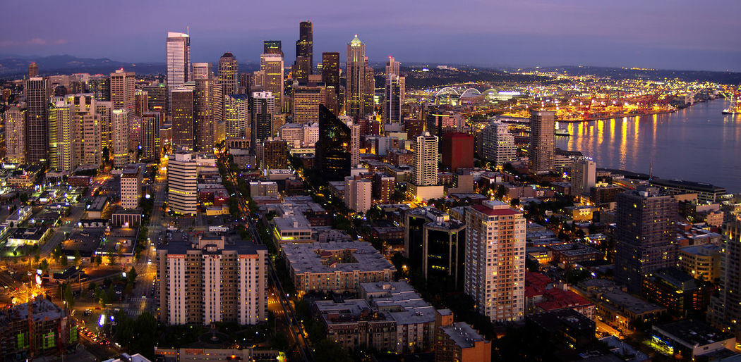 Aerial view of city lit up at night