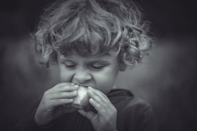 Boy eating an apple