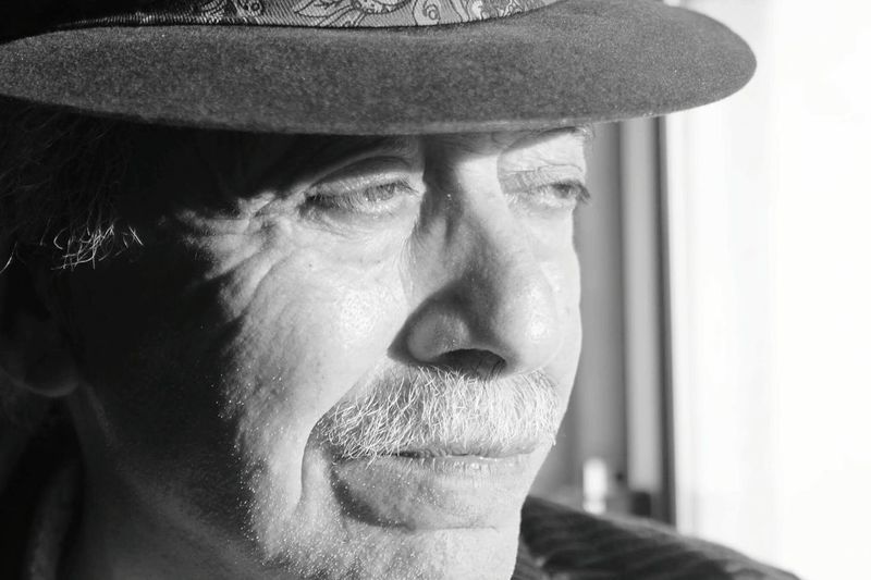 Close-up portrait of man wearing hat