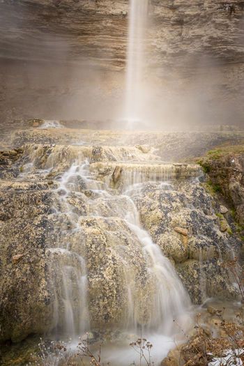Waterfall cascading down stone - long exposure