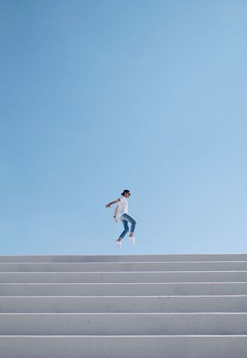 TCPM Steps And Staircases One Person Blue Day Outdoors Architecture Architectureporn Greece Built Structure Architecturelovers Architectural Feature Architecture_collection Architectureandpeople Minimalobsession Minimalpeople Real People Minimalmood Minimalist Minimalism Break The Mold Architecture Jumpstagram Jumpshot Jumping BYOPaper! Live For The Story Go Higher