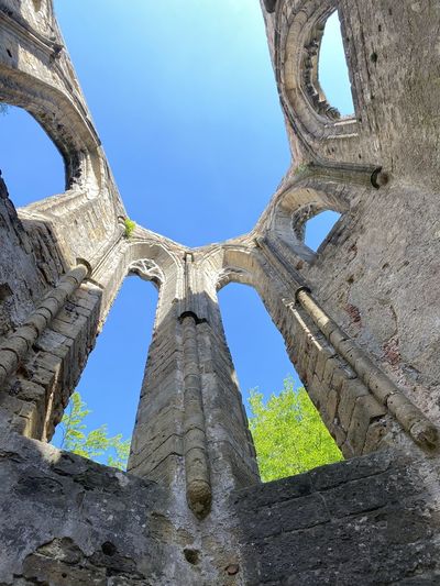 Low angle view of old ruins against clear sky